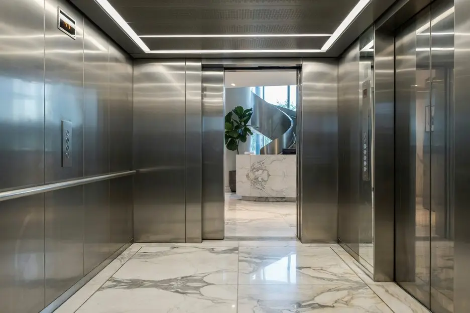 Modernized elevator cabin with upgraded stainless steel interior and advanced control system