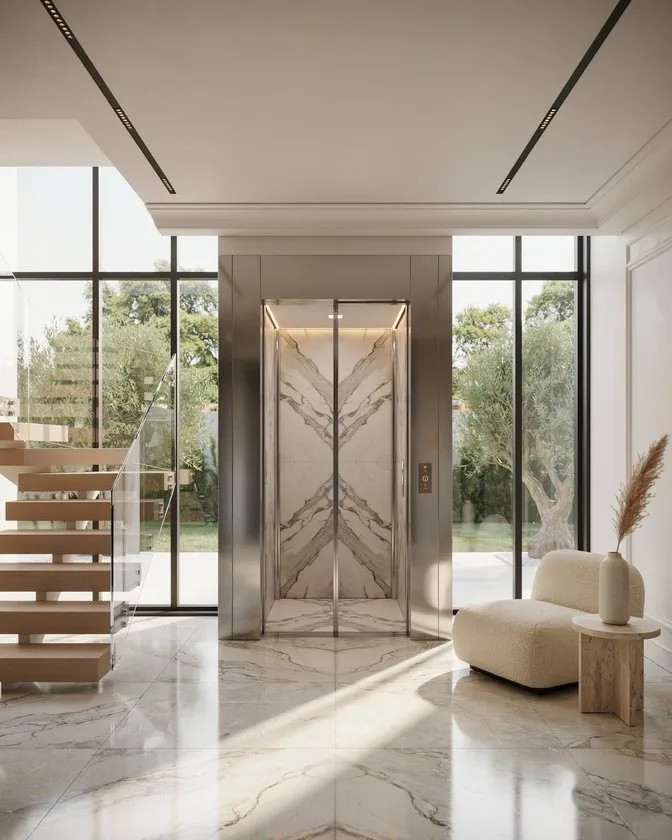Luxury home elevator with marble-finish doors installed in a modern villa in Islamabad.