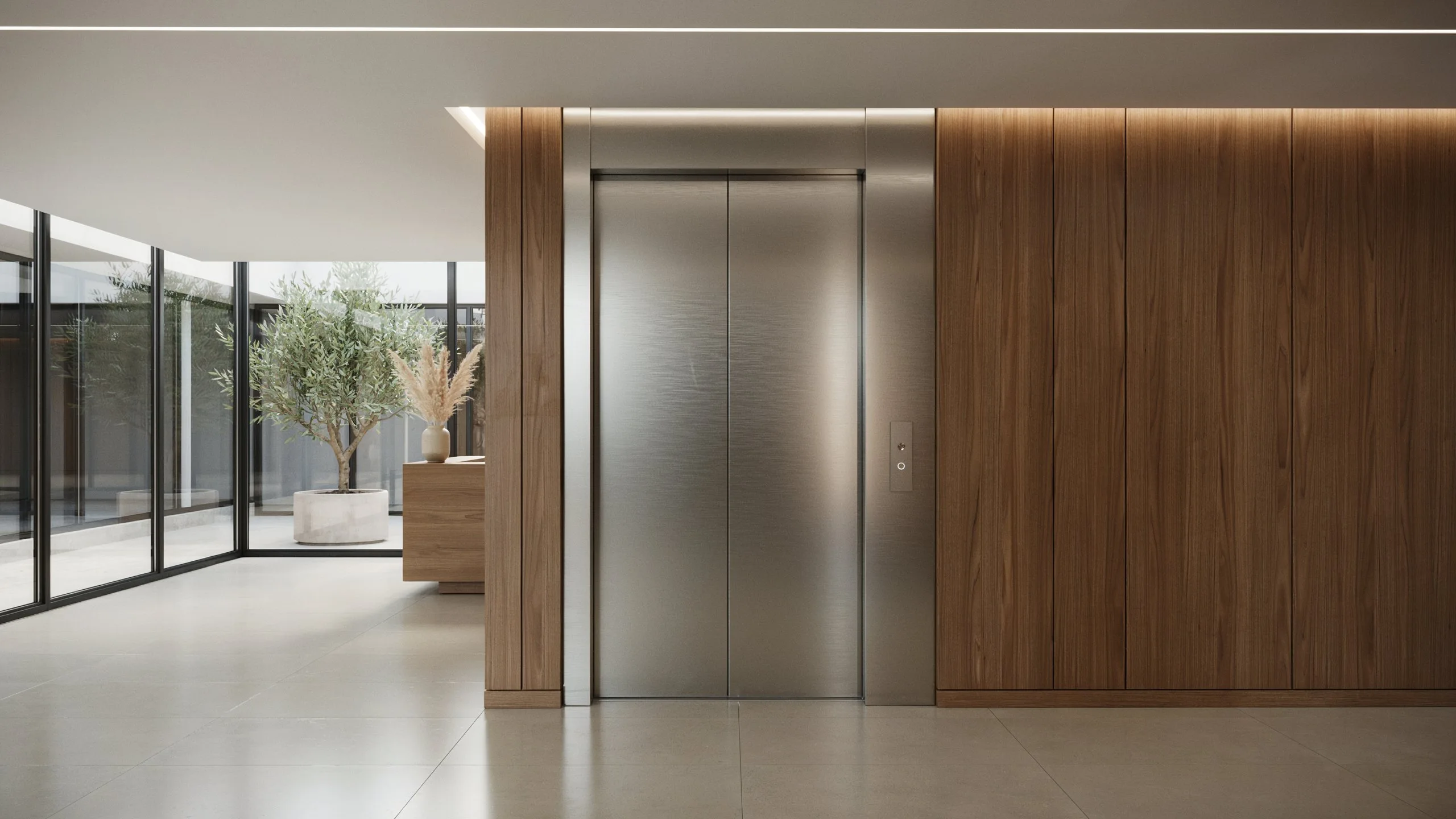 Elegant home elevator with stainless steel doors integrated into a luxury residential interior.