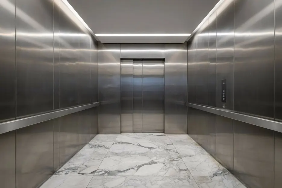 Modern stainless steel passenger elevator cabin installed by Islamabad Elevator Solutions in Islamabad and Rawalpindi.