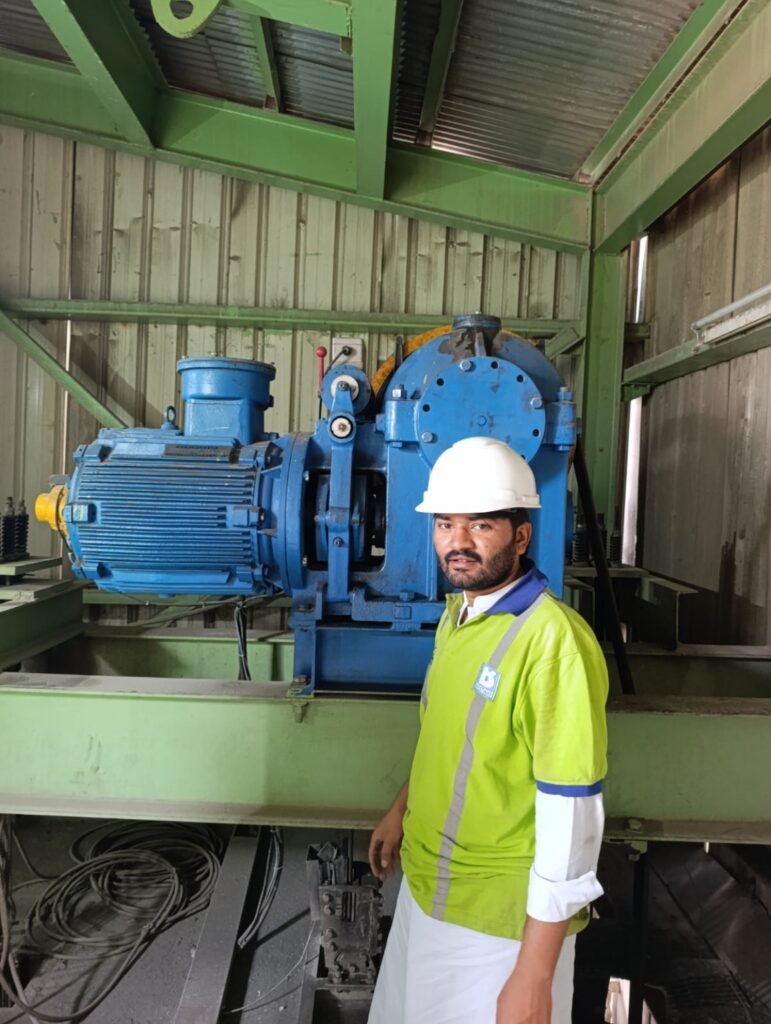 Certified elevator technician inspecting the elevator traction machine during preventive maintenance in Islamabad.
